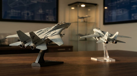 A 1:72 F-14 Tomcat and 1:100 F-14 Tomcat model displayed next to each other on a desk